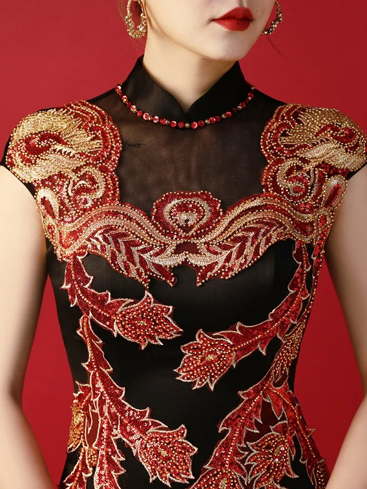 heavy-duty embroidered catwalk performance showcased host's fitted fishtail dress