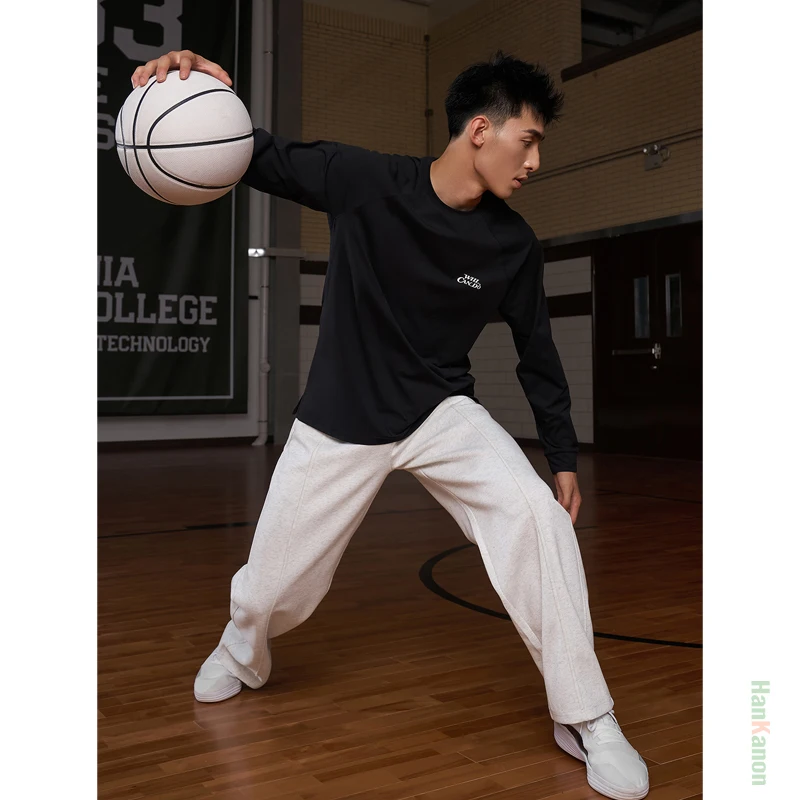 กางเกงวอร์มขาตรงแบบถักสำหรับผู้ชาย สไตล์อเมริกันลำลอง เหมาะสำหรับเล่นบาสเกตบอลและวิ่ง ผลิตจากผ้าฝ้าย 64% ระบายอากาศได้ดี ซับเหงื่อ