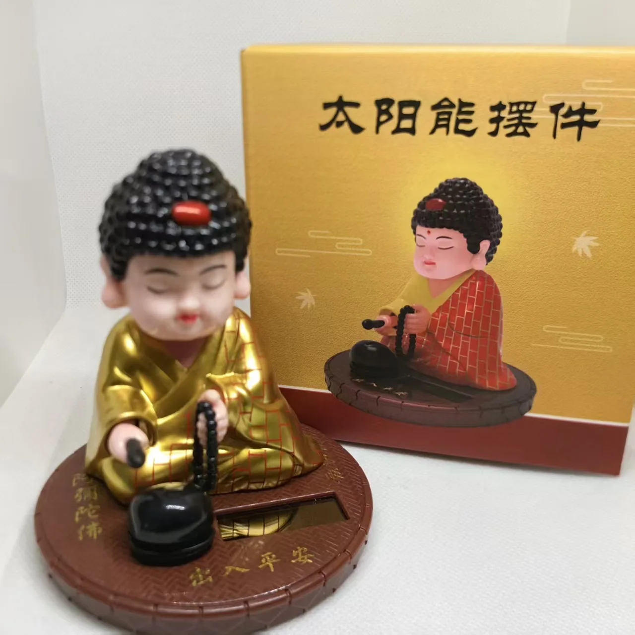 

Suitable for car dashboard, solar Sakyamuni ornament, shaking head and nodding doll, no battery required, car home decoration