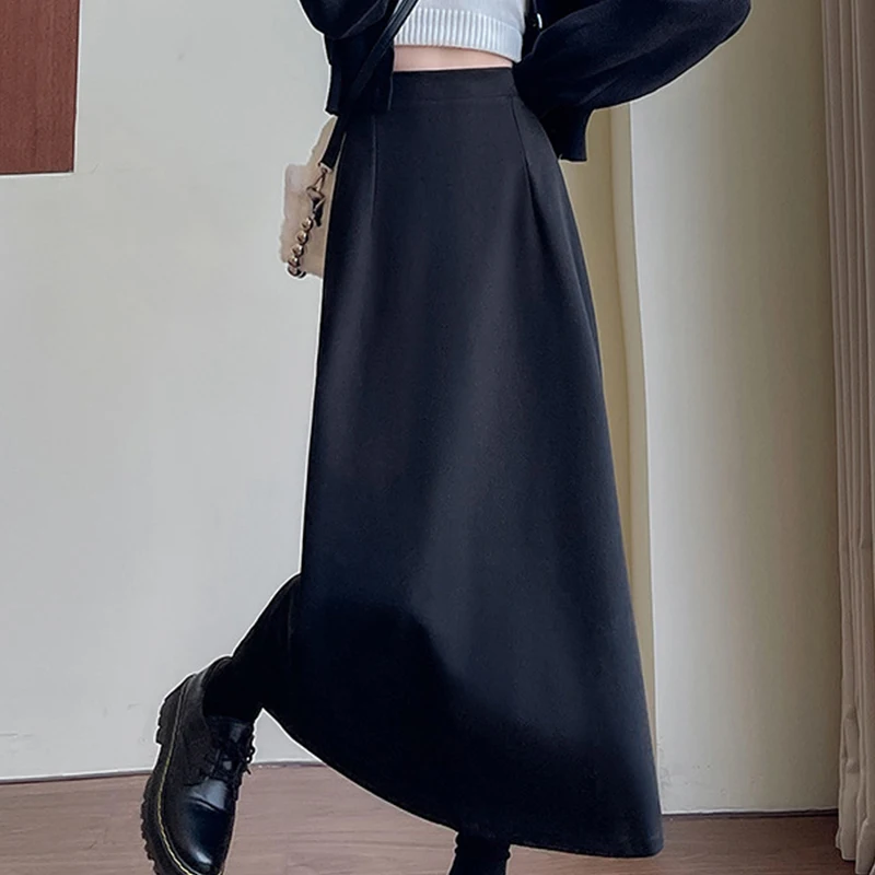 Długie spódnice damskie z wysokim stanem na jesień i zimę 2025, nowe, jednolite, uniwersalne spódnice w kształcie litery A z rozcięciem z tyłu.