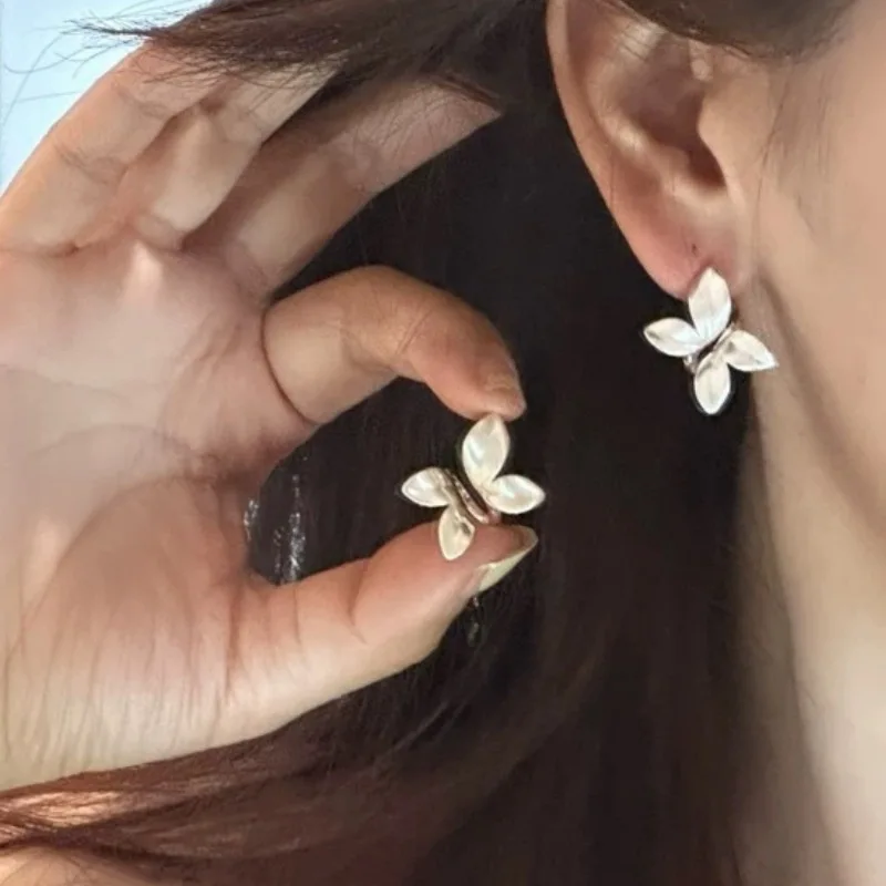 Metal brushed three-dimensional butterfly stud earrings women's niche design sense high-end earrings 2026 new temperament earrin