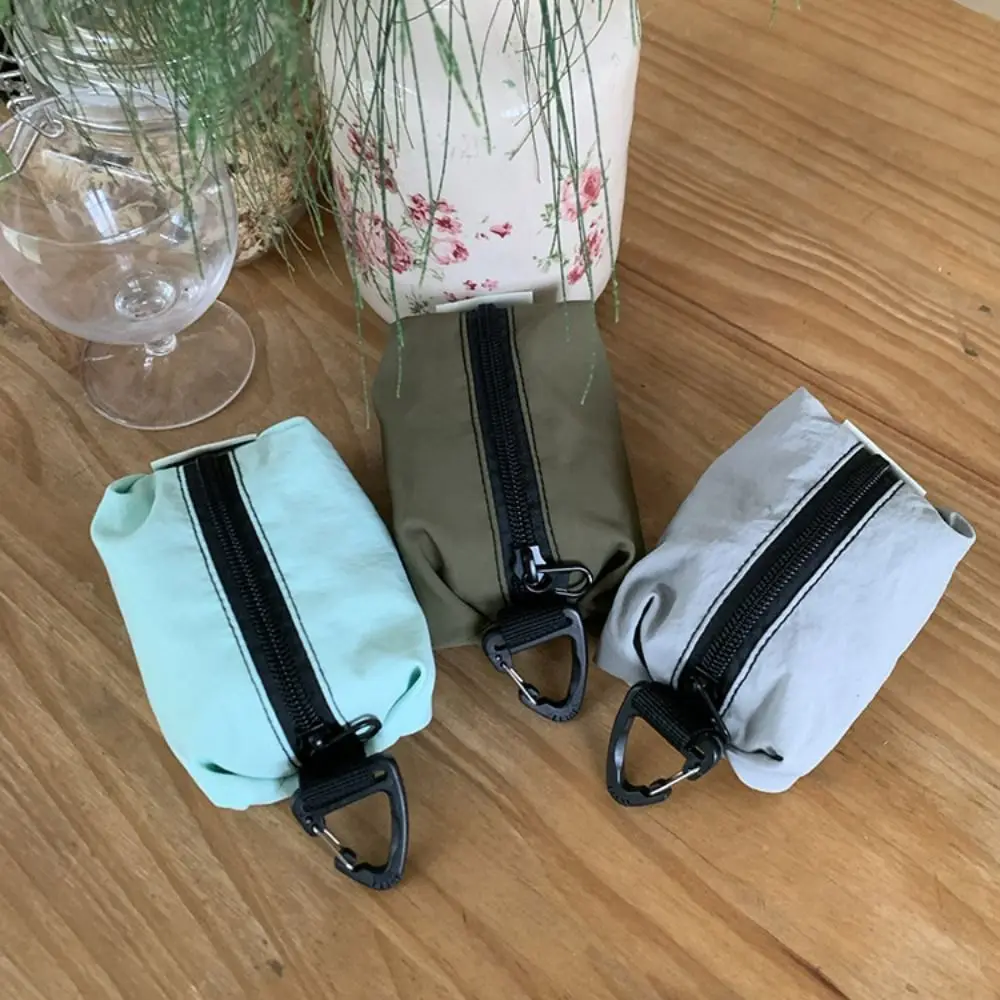 Monedero portátil de tela de nailon, estilo coreano, gran capacidad, cremallera, bolsa para artículos pequeños, bolsa de cosméticos ligera de Color sólido para auriculares