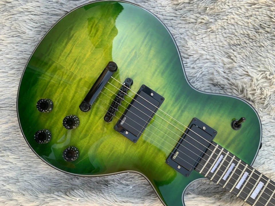 In stock green color mahogany wood body with quilted maple top six string LP electric guitar, we can customize the guitar