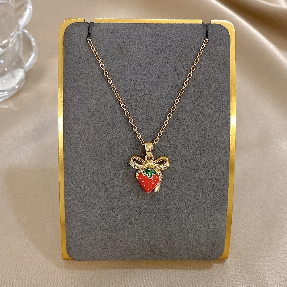 

DODOHAO Stainless Steel Choker Necklace Women Rhinestone Strawberry Bowknot Pendant Necklace Exquisite Adjustable Clavicle Chain