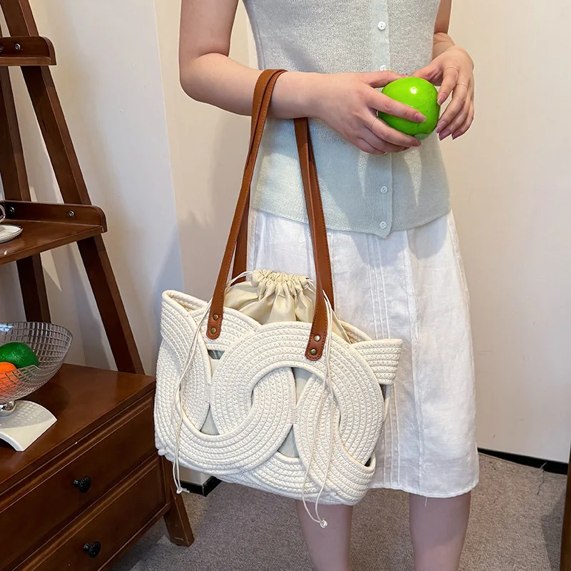 

Niche woven bag women's 2026 new trendy spring and summer hollow shoulder bag large capacity tote bucket bag