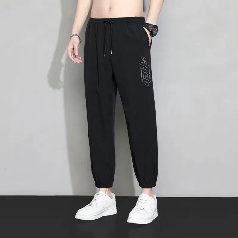 

Сплошной цвет, модные спортивные брюки с переплетом на щиколотке, длинные весенние мужские молодежные модные повседневные тонкие бегуны свободного покроя, мужская одежда