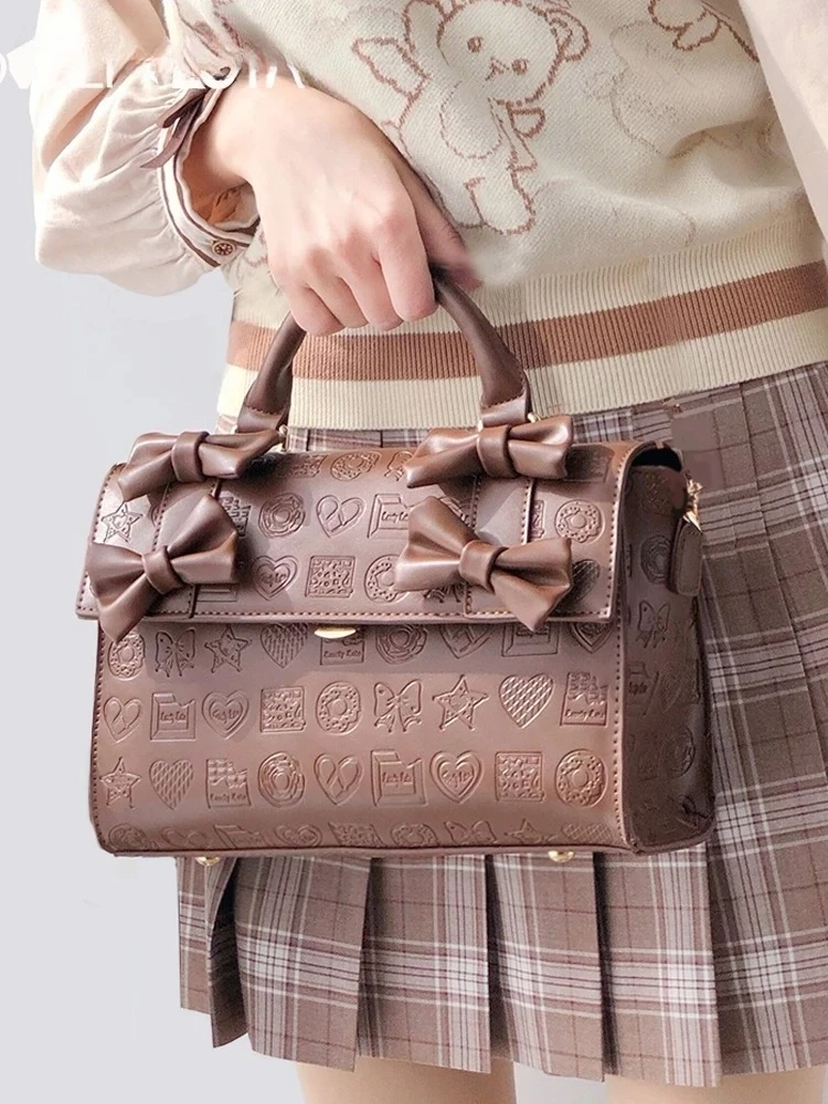 

Japanese Original Retro Lolita Style Embossed Bow Handbag Sweet and Fashionable Versatile Office Womens Shoulder Messenger Bag