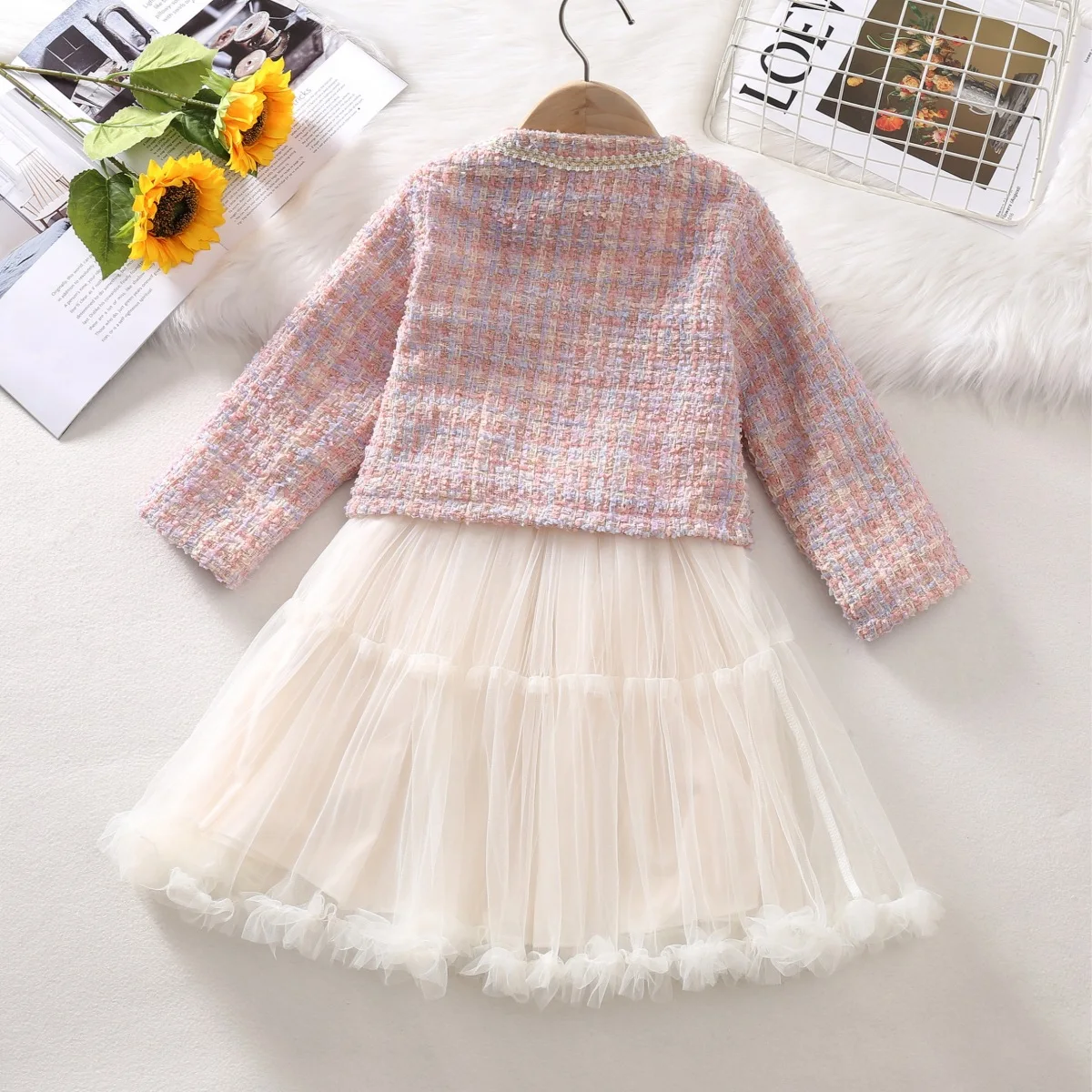 trendy and stylish two-piece autumn suit dress for a little girl with a chanel-style bow