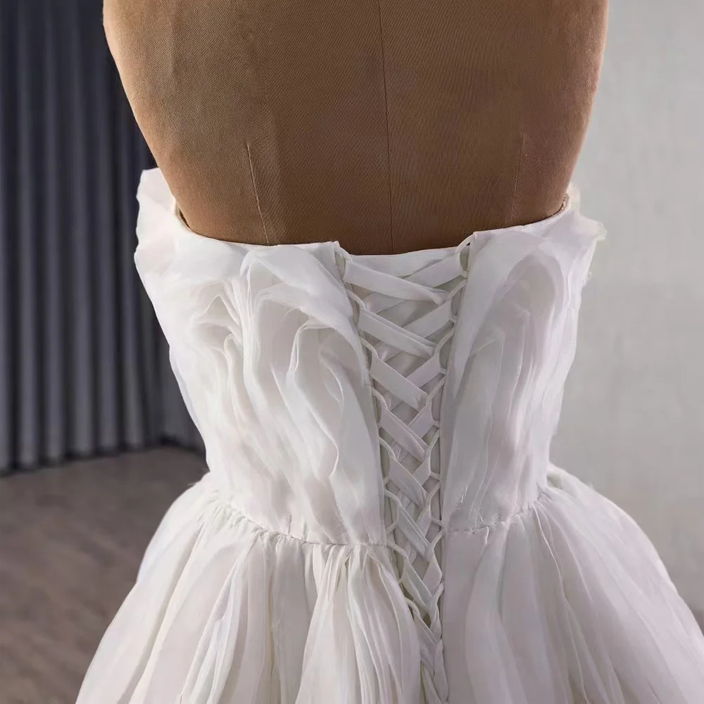 Abito da sposa sexy in pizzo senza spalline senza maniche con volant sul retro con lacci 2026 Robe De Mariage