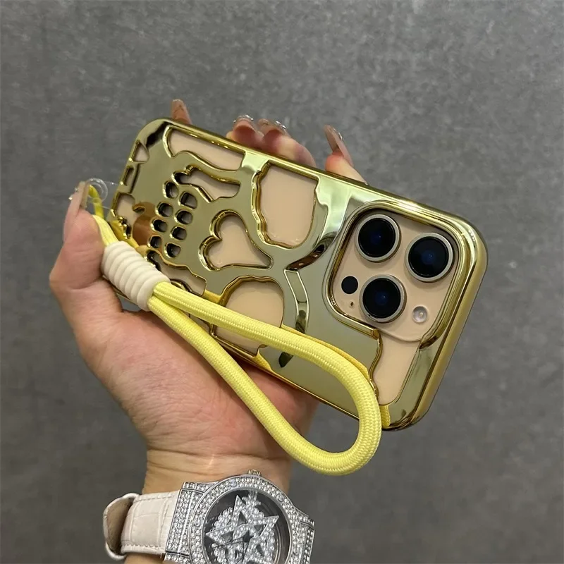 Luxury Hollow Skull Wristband Lanyard Case for iPhone 16 15 14 13 12 11 Pro Max Plus Plating Heat Dissipation Shockproof Cover