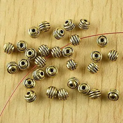 

50pcs 5.1x4.7mm hole is 1.4mm dark gold-tone curved line spacer beads h2212