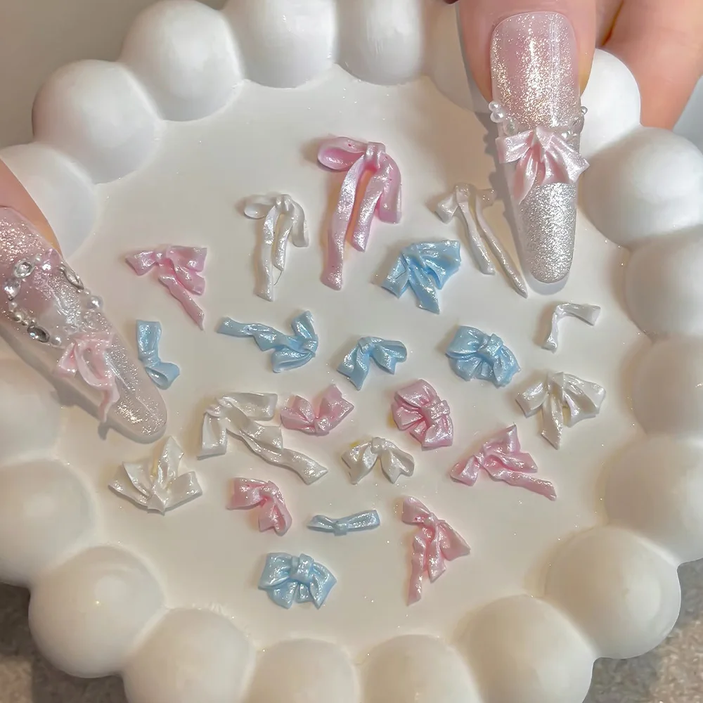 

50Pcs Mixed Pearlescent Bowknot Nail Charms 3D Pink/Blue/White Soft Carving Ribbon Bow Nail Accessories Satin Bowtie Nail Decora
