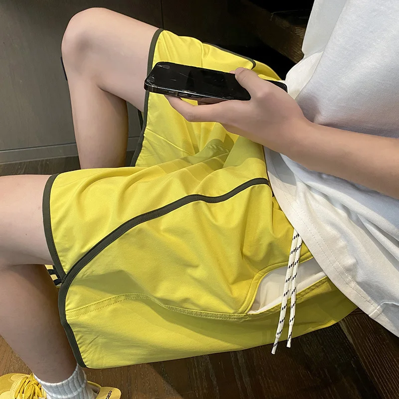 LUZHEN 2025 Estate Stripe Splicing Pantaloncini ad asciugatura rapida Sport Moda uomo Pantaloni casual larghi dritti Vita elastica Nuovo JY2893