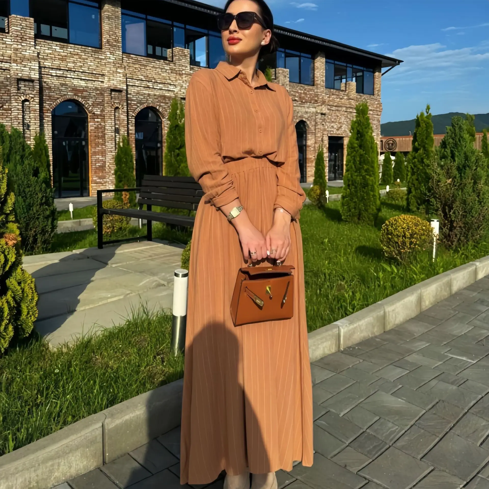 

New fashion temperament long-sleeved top high waist rubber band skirt skirt two-piece set simple and versatile elegant holiday s