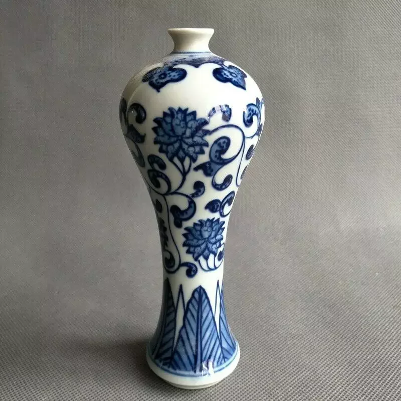 Hand-painted floral design on a blue and white porcelain vase, China