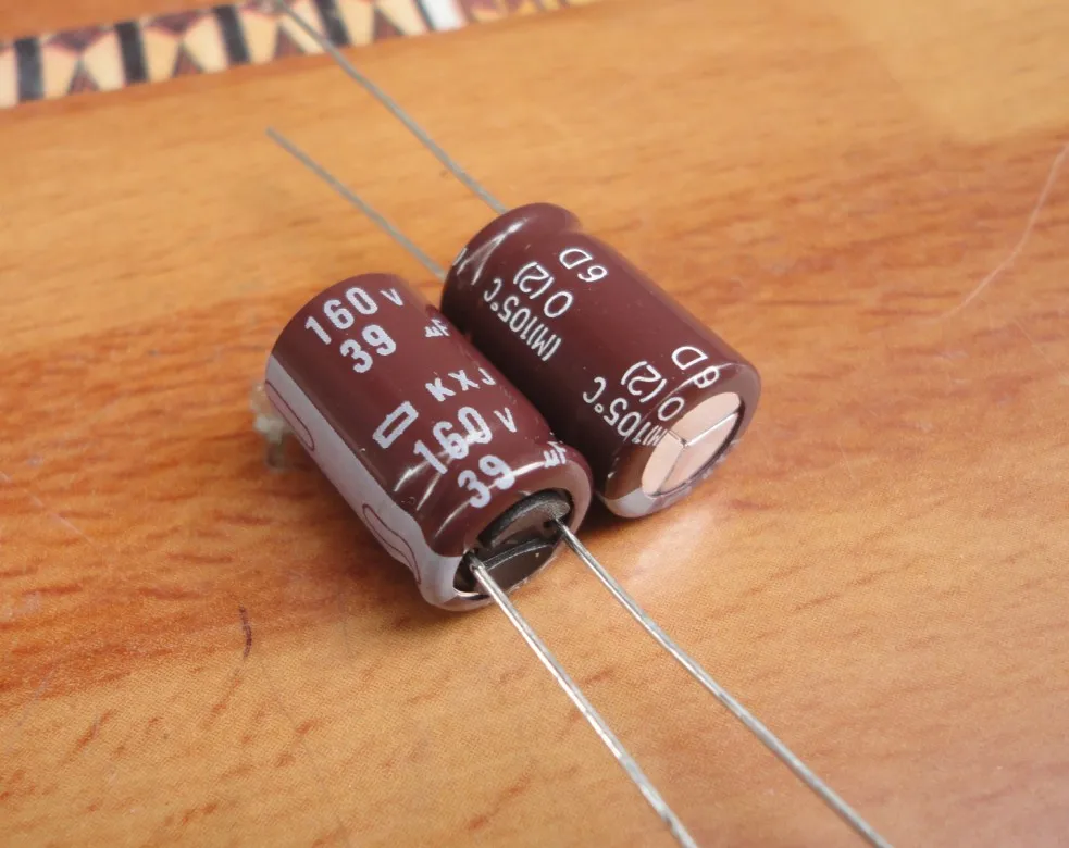 50 Buah/Lot Asli Jepang NIPPON KXJ Seri 105C Kapasitor Frekuensi Tinggi Aluminium Kapasitor Elektrolit Gratis Pengiriman