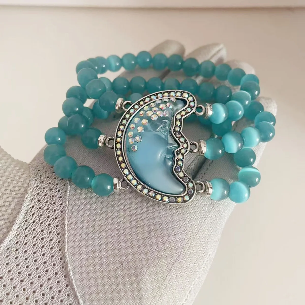 

MITTO FASHION JEWELRIES AND HIGH-END ACCESSORIES RHINESTONES PAVED MYSTIC MOON FACE CAT EYE BEADS WOMEN STRETCH BRACELET