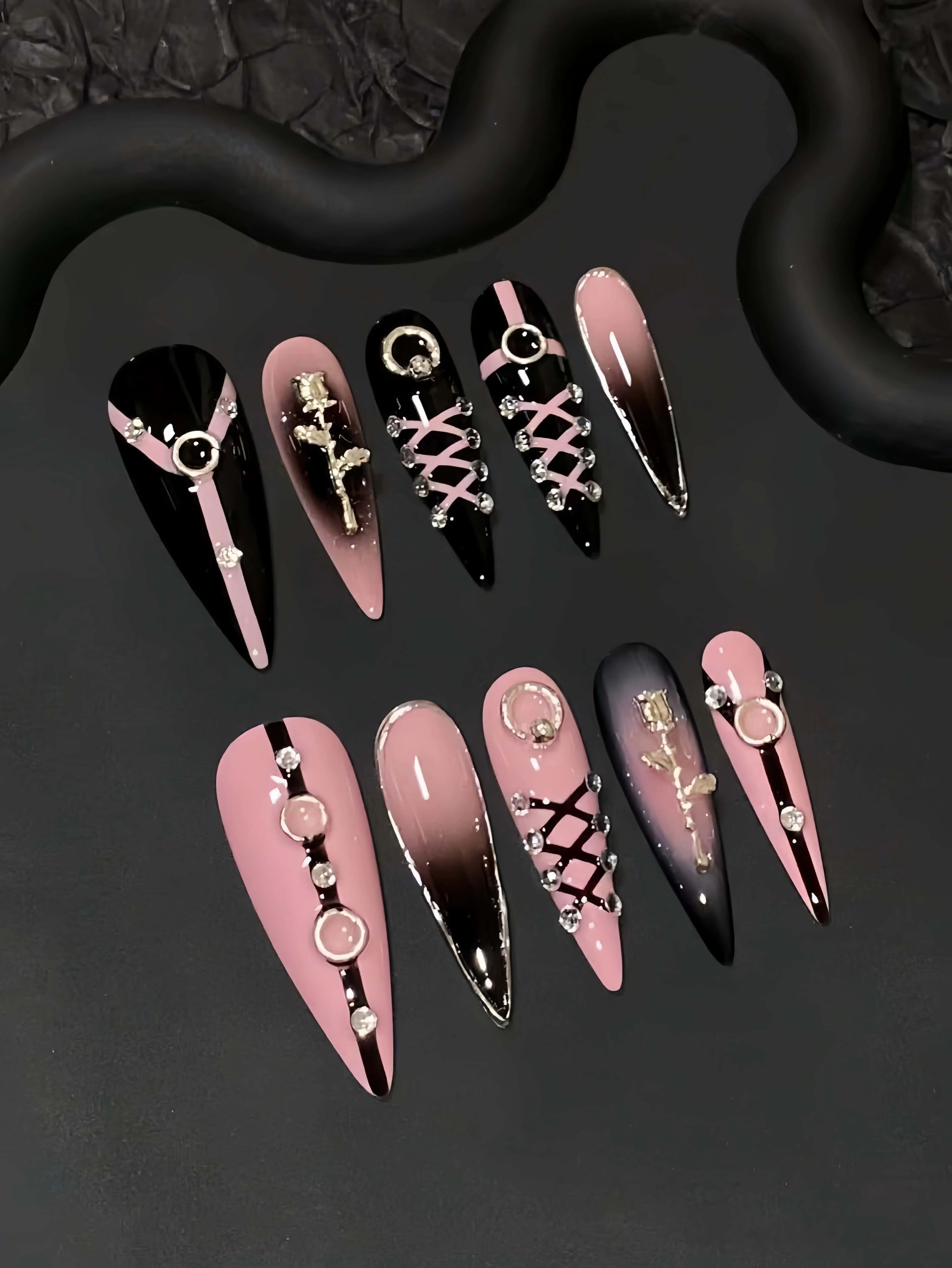 10 Pieces of Handmade Almond-Shaped Full-Cover Nail Tips, Medium-Length, with Black and Pink Gradient Color Scheme, Featuring Tie Lines, Metallic Rose and Circular Rhinestone Decorations, in a Spicy Dark Sweet-Cool Style, Suitable for Women and Girls, Perfect for Summer Vacations, Graduation Season, and as a Gift, Comes with 1 Piece of Jelly Glue and 1 Nail File