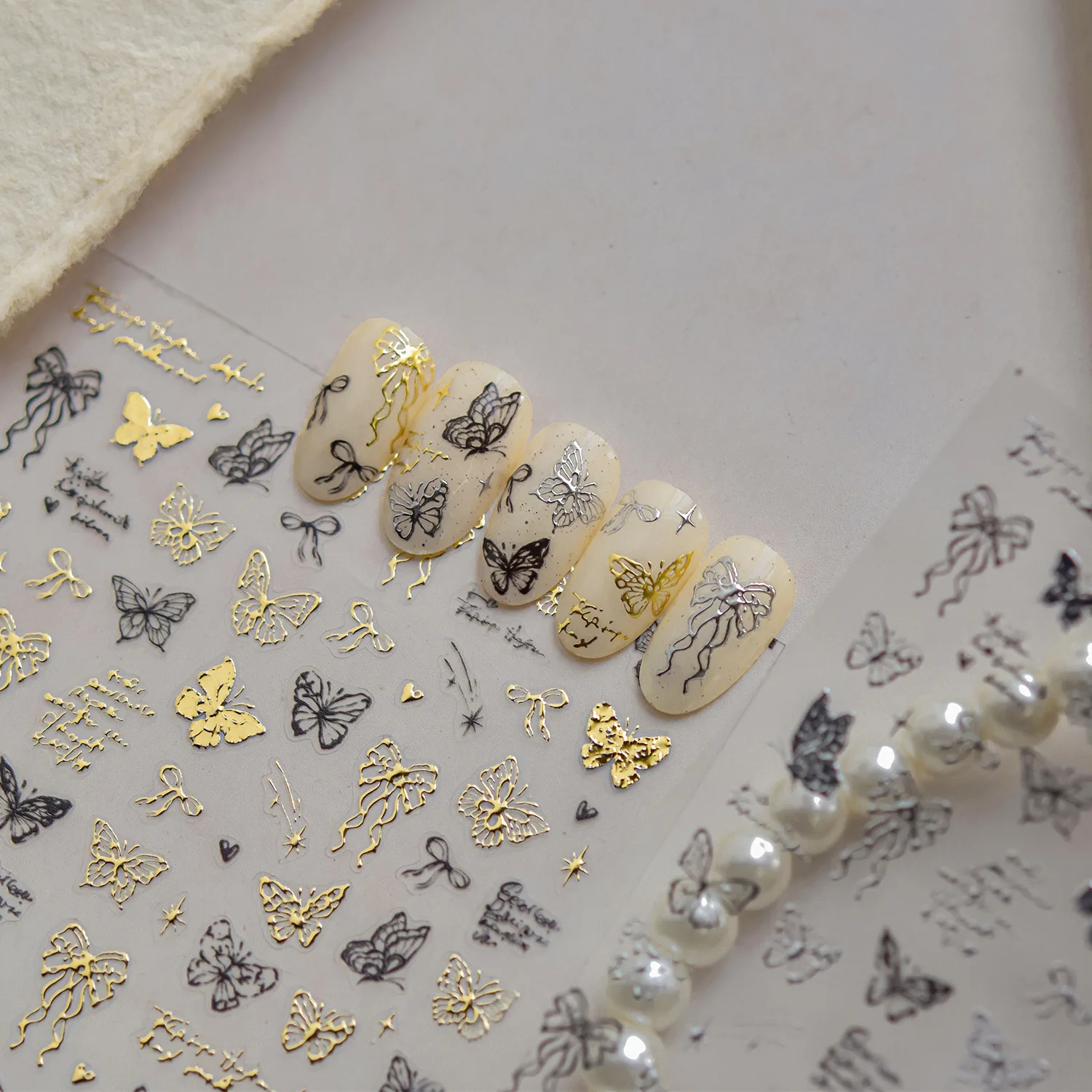 Delicado brillante oro plata negro hueco mariposa cinta arco adhesivo pegatinas para decoración de uñas calcomanías manicura adornos finos