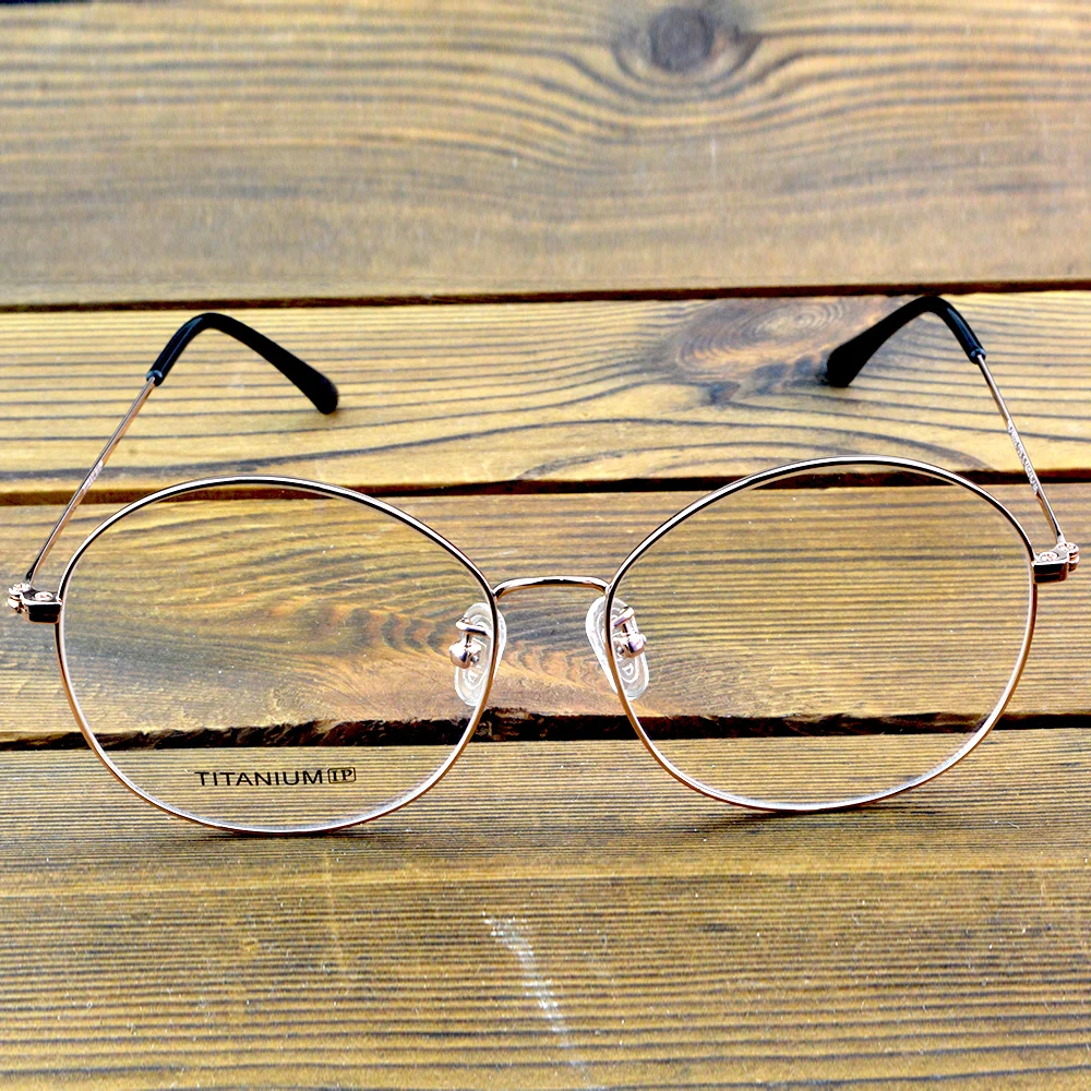 إطار نظارات بصرية دائرية كلاسيكية مطلي بسبائك التيتانيوم مع لمسة نهائية من الذهب الوردي