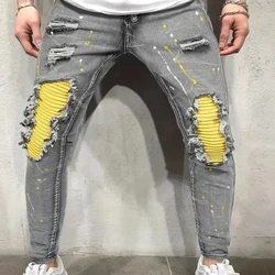 Pantalones vaqueros ajustados con diseño rasgado y salpicaduras de pintura de alta elasticidad estilo callejero creativo informal para hombre para primavera y verano