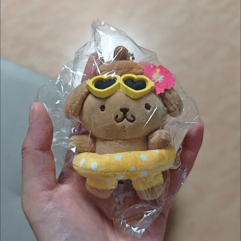 Zwart lederen zwemringen Pudding Hond Poppen Leuke cartoonanimatie Perifere knuffels Rugzakken Pluche hangers Meisjescadeau