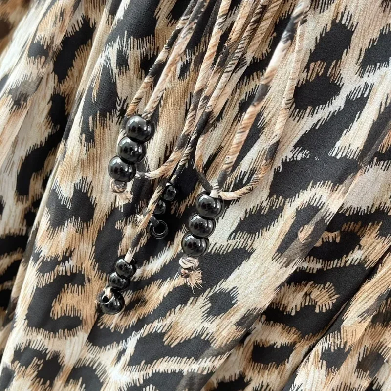 Mini abito da donna con stampa leopardata nera a maniche lunghe con volant abbigliamento quotidiano per 2024 nuovi arrivi di alta qualità