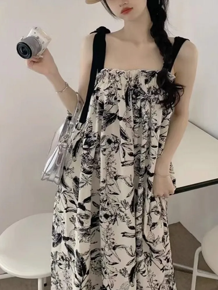 ชุดเดรสยาวทรงเอไลน์ผ้าชีฟองพิมพ์ลายดอกไม้สีน้ำ สไตล์ลำลองสำหรับฤดูร้อน เหมาะสำหรับใส่ไปเที่ยวชายหาด ช่วยพรางหุ่นให้ดูเพรียวบาง