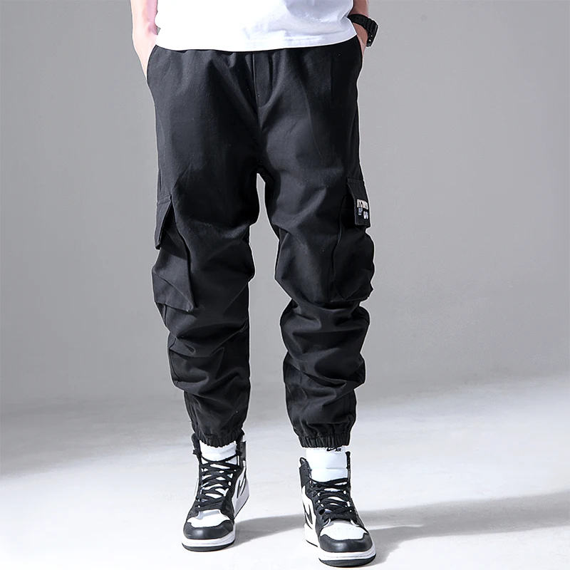 Moda męska Hip Hop Cargo spodnie z wieloma kieszeniami modna odzież uliczna solidne spodnie dresowe Casual bawełniane biegacze męskie
