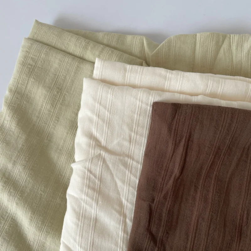 

Apricot color, fruit green, chestnut color solid color woven stripe jacquard semi-transparent pure cotton clothing DIY fabric