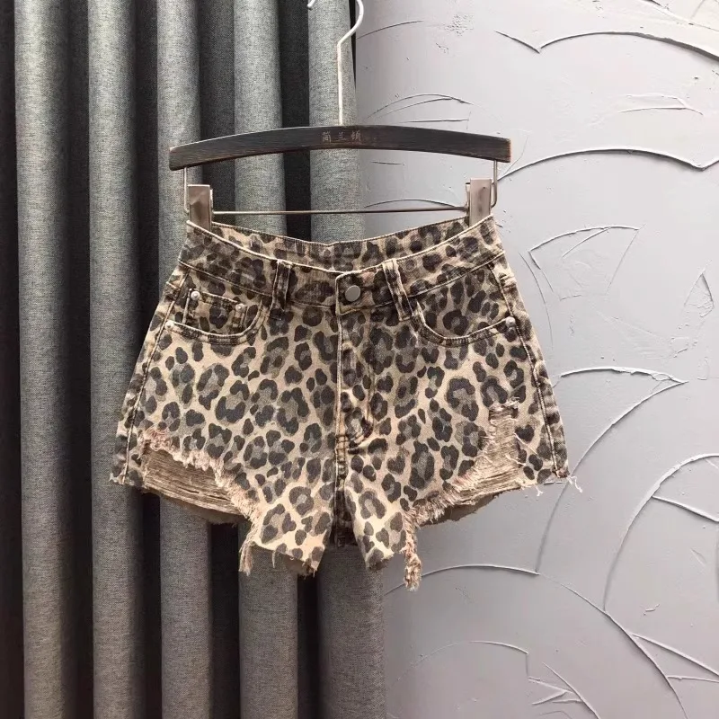Pantalones cortos vaqueros de cintura alta con estampado de leopardo personalizados, moda de verano para mujer, pantalones vaqueros de pierna ancha con borde áspero, pantalones calientes