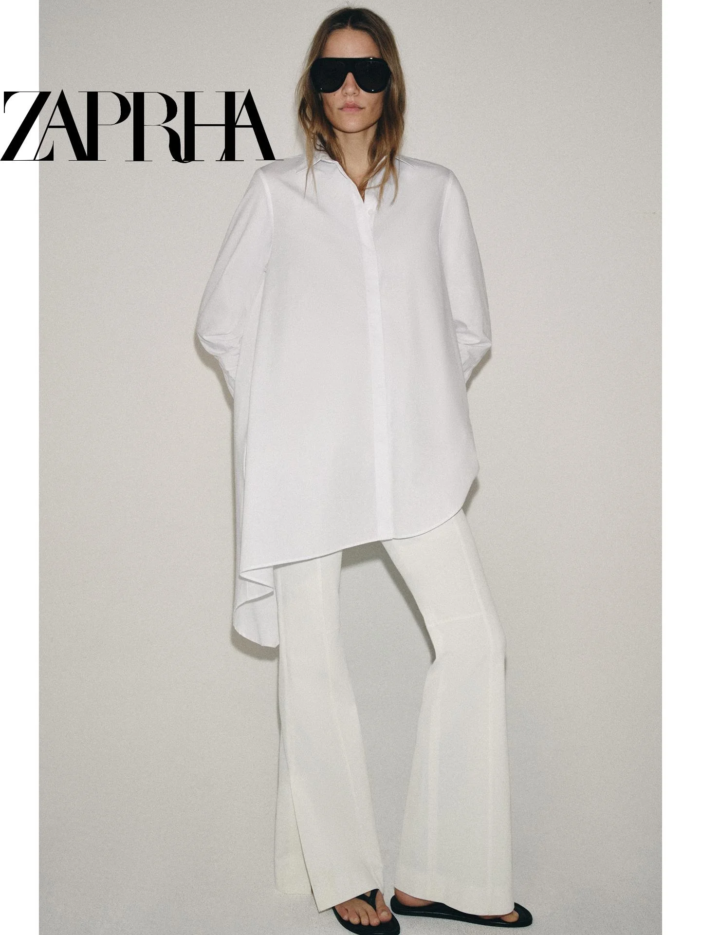 

Summer 2026 Women's Casual Loose Fit Long Sleeve Shirt Asymmetrical Hem Collared Minimalist Design Versatile Slimming Effect