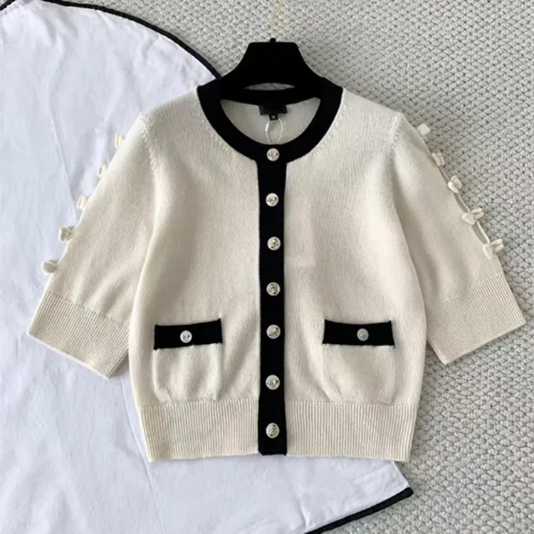 ملابس نسائية أوروبية وأمريكية مخصصة لشتاء 2025 سترة محبوكة من الكشمير بأكمام قصيرة وصدر واحد