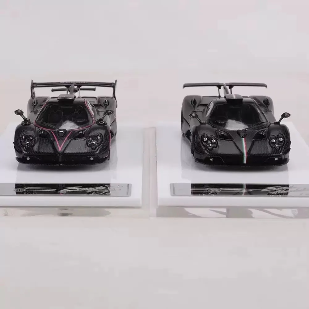 1:64 scale alloy die-cast model car with a hinged rear engine hood, for display as a collector's item