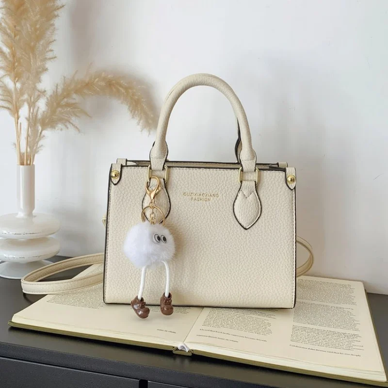 

Элегантный классический кожаный клатч для женщин, идеально подходящий для делового отдыха с однотонным модным дизайном