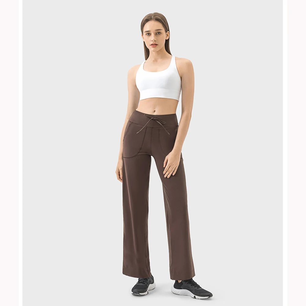 Waist tied drawstring wide leg pants with large pockets on both sides, versatile fitness and sports pants for women