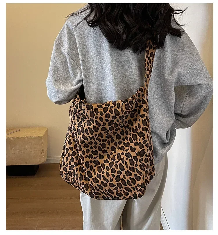 Woman carrying the oversized leopard print crossbody bag