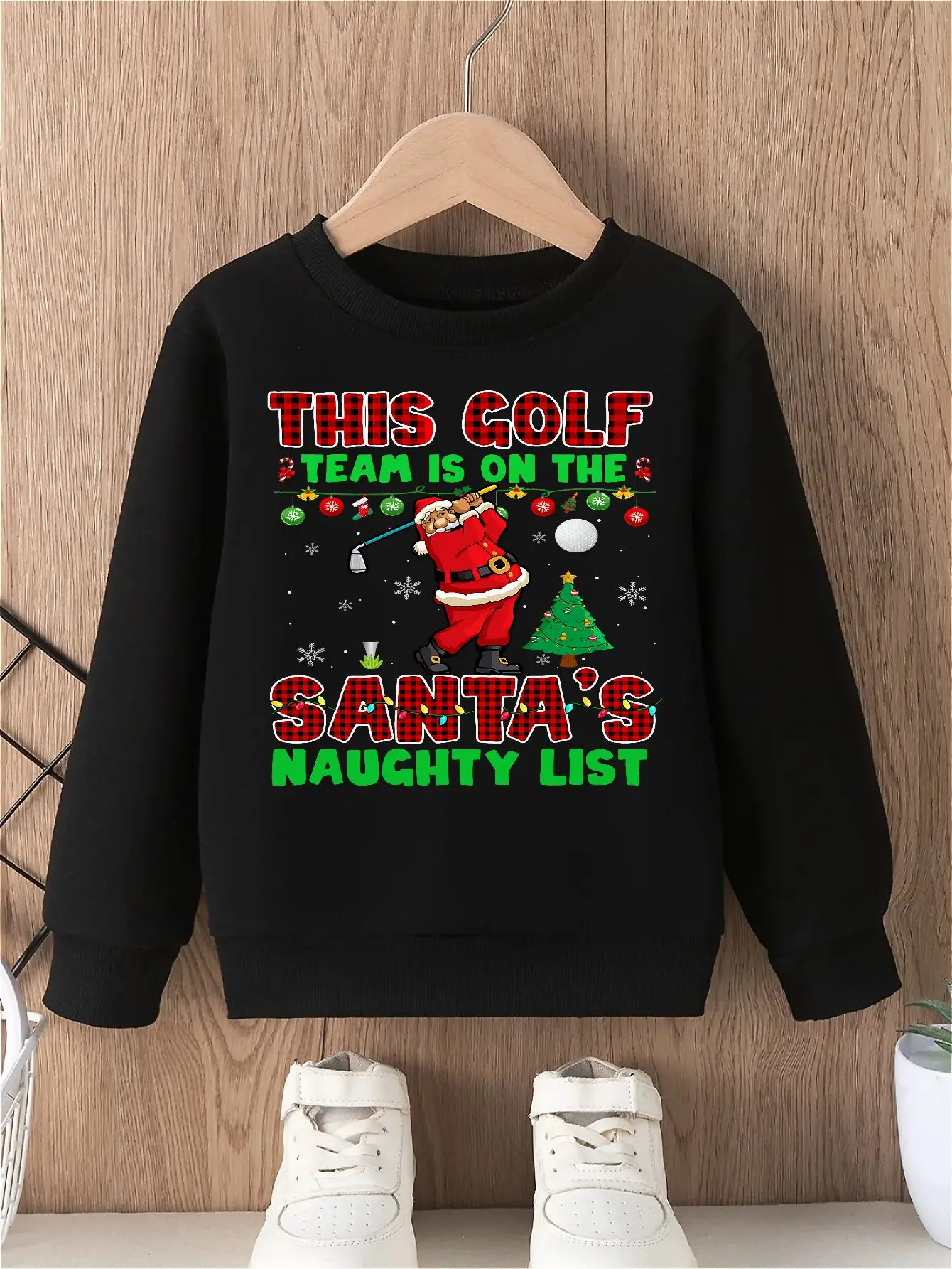 Santa's Naughty List boy's pullover sweatshirt with playful Santa golfing graphic, festive and stylish round neck long sleeved