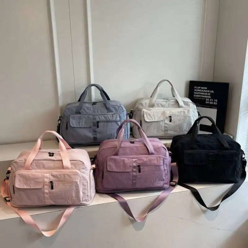 

Duffle Bag Large Capacity Waterproof Nylon Luggage with Multiple Pockets Adjustable Shoulder Strap Durable Foldable Tote Travel