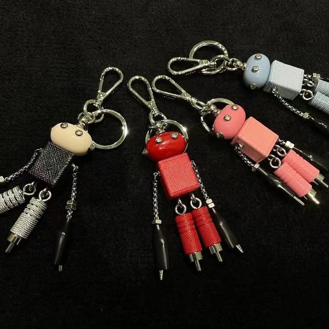 Robot pendant, keychain, leather bag hanging, paired with artifact enamel triangle emblem hanging decoration