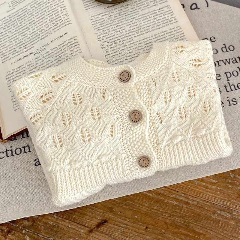 Autumn new baby clothing, 0-3 year old female baby sweater hollowed out knitted cardigan A-line versatile jacket outer layer