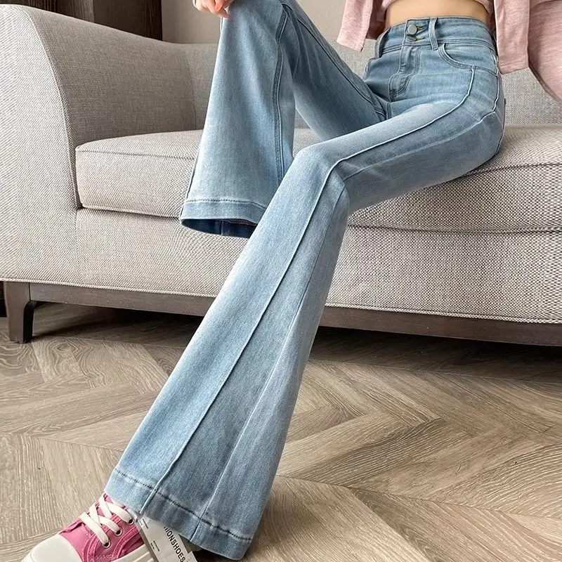 Americano retro cor contrastante micro-flare jeans feminino 2025 primavera e outono nova barriga-aperto nádegas emenda