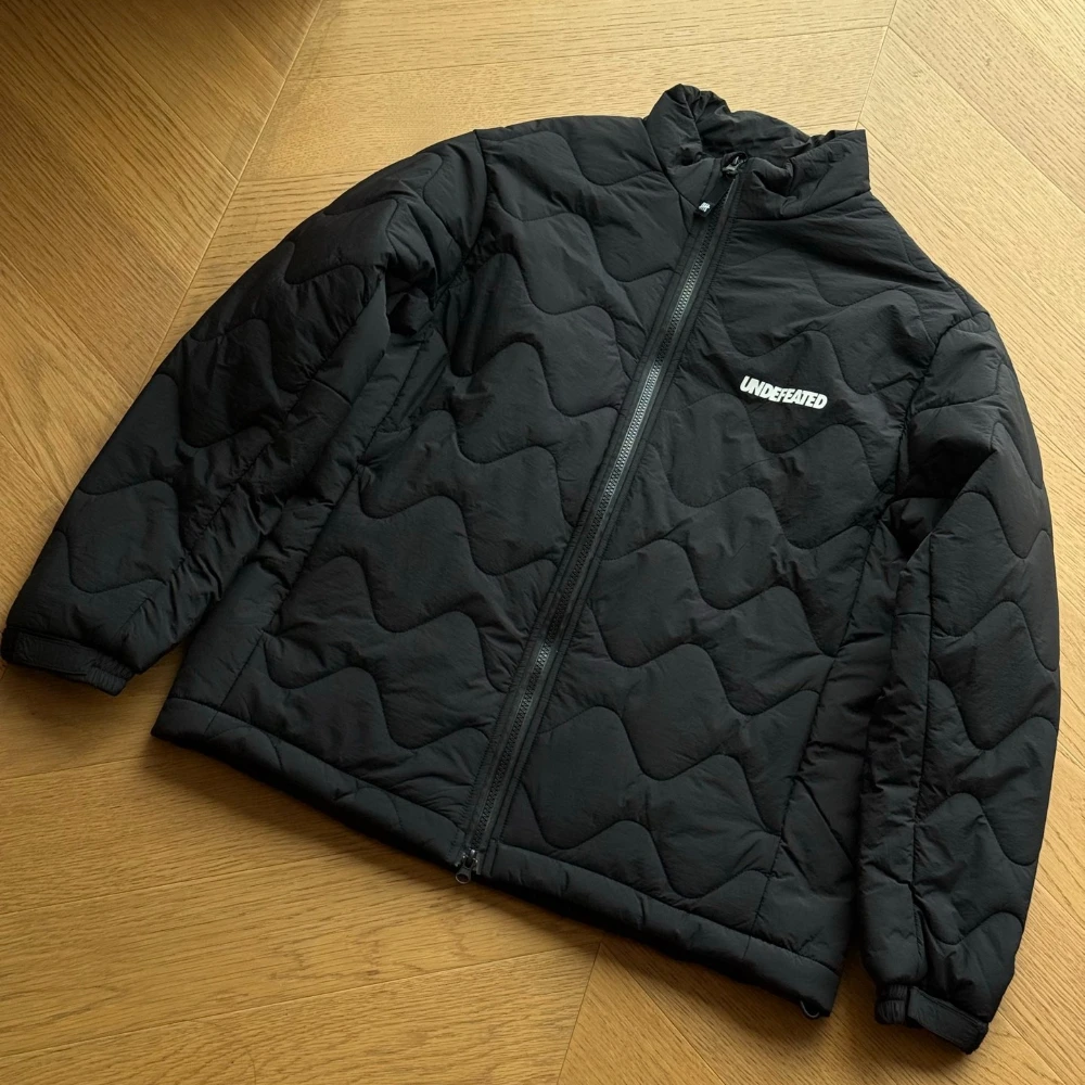 UNDEFEATED Five-Stripe Logo Gourd Quilted Zip-Up Stand Collar Thermal Loose Fit Unisex FW26 Padded Jacket for Streetwear Commute