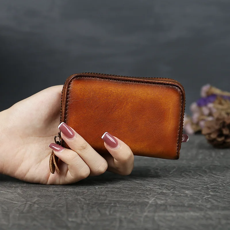 Skórzany mini portfel dla kobiet i mężczyzn z kieszonką na monety, 9 przegródek, wielofunkcyjny portfel na zamek błyskawiczny, kompaktowy organizer na karty i pieniądze.