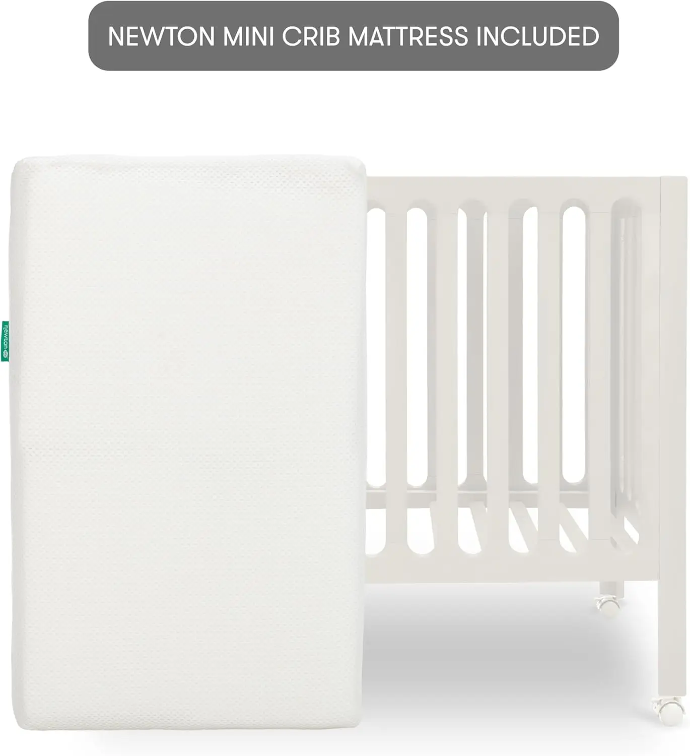 Newton Baby Galileo Mini Crib من خشب الزان الصلب مع عجلات باللون الأبيض الدافئ، مرتبة سرير صغيرة متضمنة