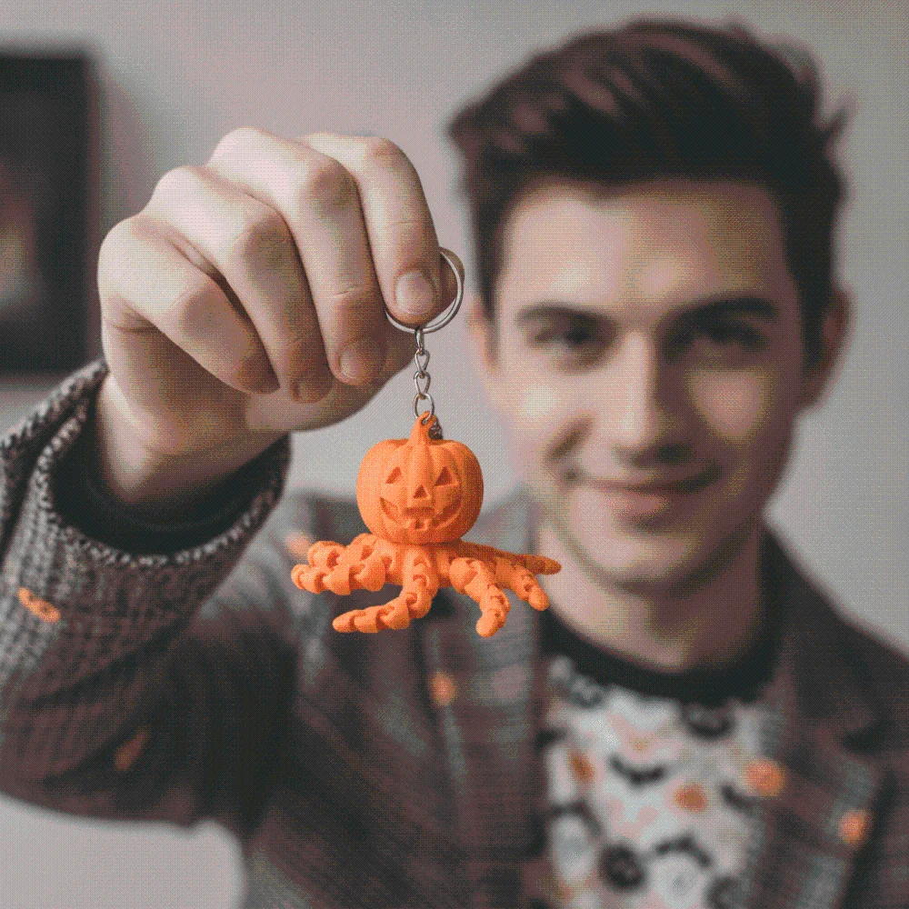 Glow In The Dark Pumpkin Key Chain Articulated Jointed Rotating Design Ghost Key Ring Vibrant Colors Flexible Tentacles