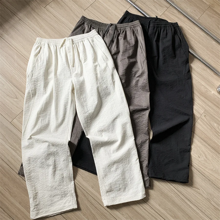 

Японские повседневные брюки Goldwin с пузырчатой текстурой, однотонные, унисекс, высококачественные, солнцезащитные, свободные, тонкие, быстросохнущие, с пылезащитным мешком