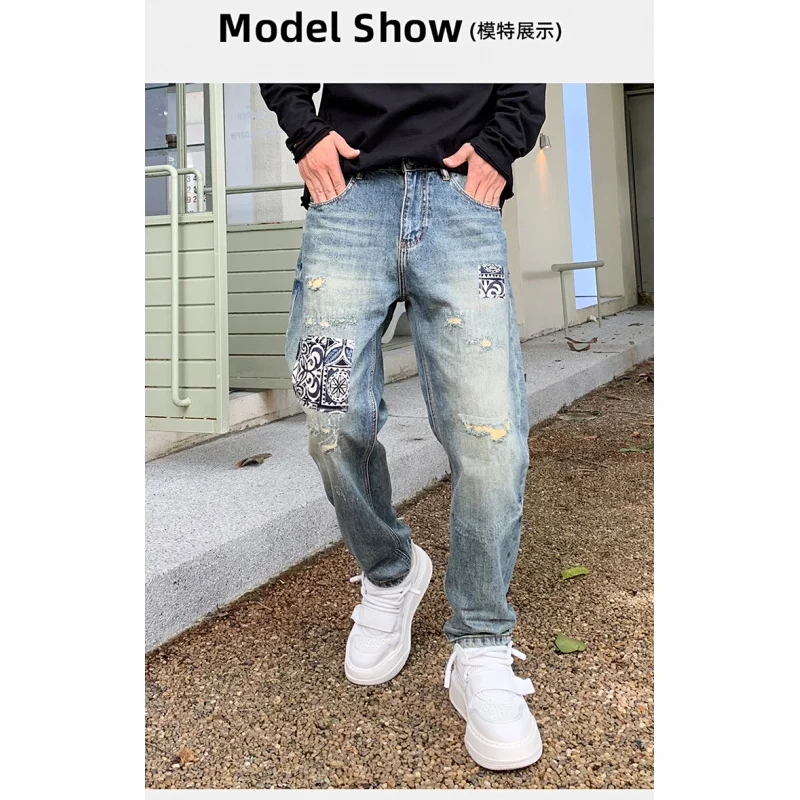 New high-end fashion tapered jeans men influx of loose pants personalized scraping hole patches Harlan pants men's pants