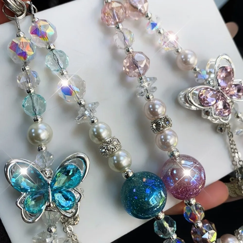 

Ремешок для телефона с кристаллами и жемчугом в виде бабочки, цепочка на запястье, защита от потери, роскошный шнурок для мобильного телефона