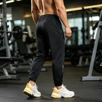 Pantalon de jogging léger et respirant en soie glacée pour homme, grande taille, avec poches zippées, extensible, idéal pour le quotidien, le sport et le fitness 4